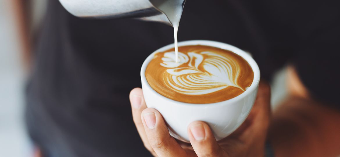 barista making latte