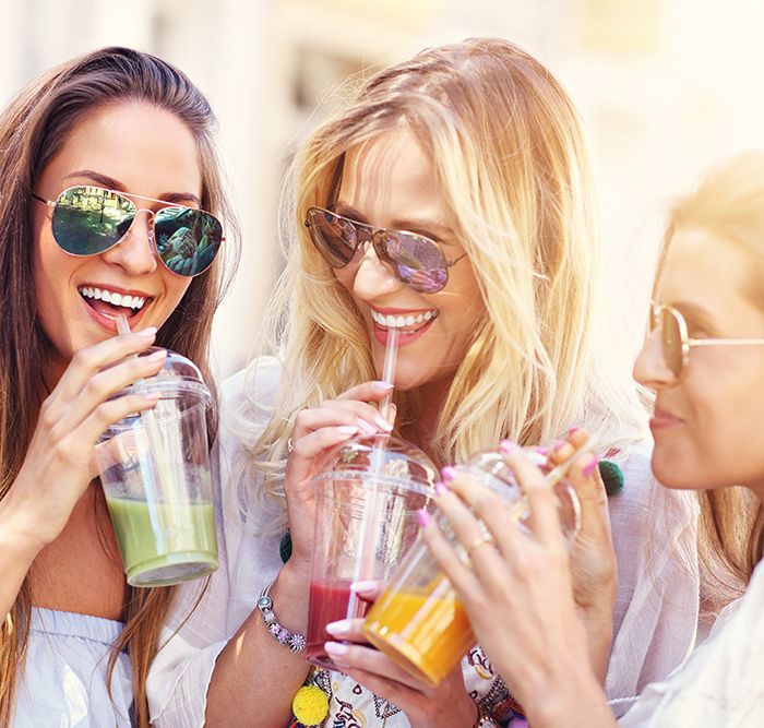 3 happy girls with smoothies from PureFyx on Cleveland Wellness Crawl