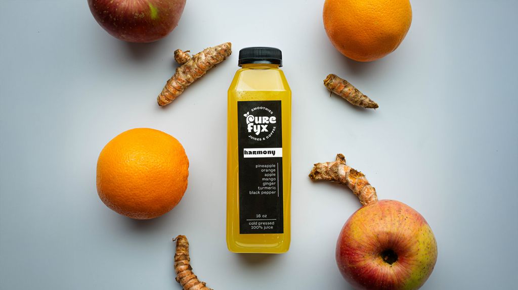 harmony cold pressed juice with apples, orange, and ginger