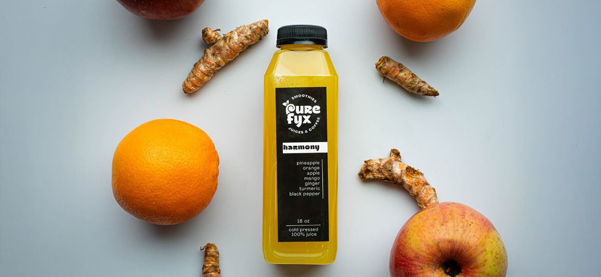 harmony cold pressed juice with apples, orange, and ginger