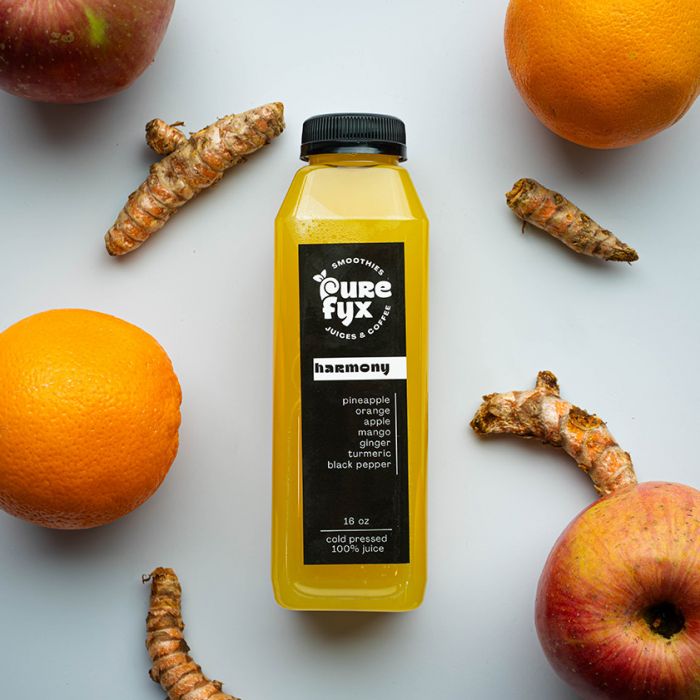 harmony cold pressed juice with apples, orange, and ginger