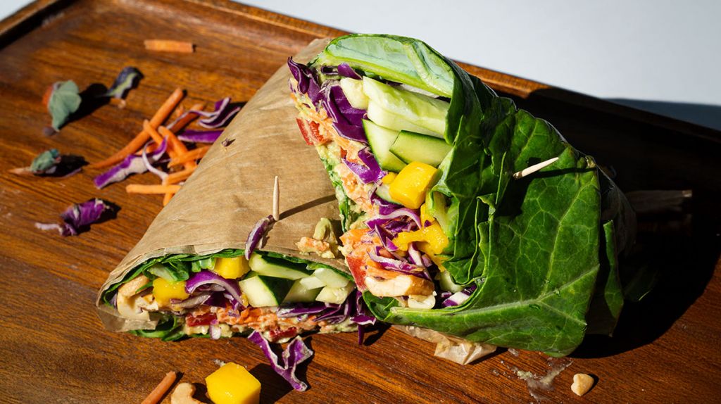 healthy Pure Bliss wrap with Collard greens, mango, cabbage, tahini ginger drizzle