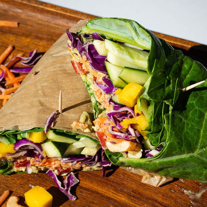 healthy Pure Bliss wrap with Collard greens, mango, cabbage, tahini ginger drizzle