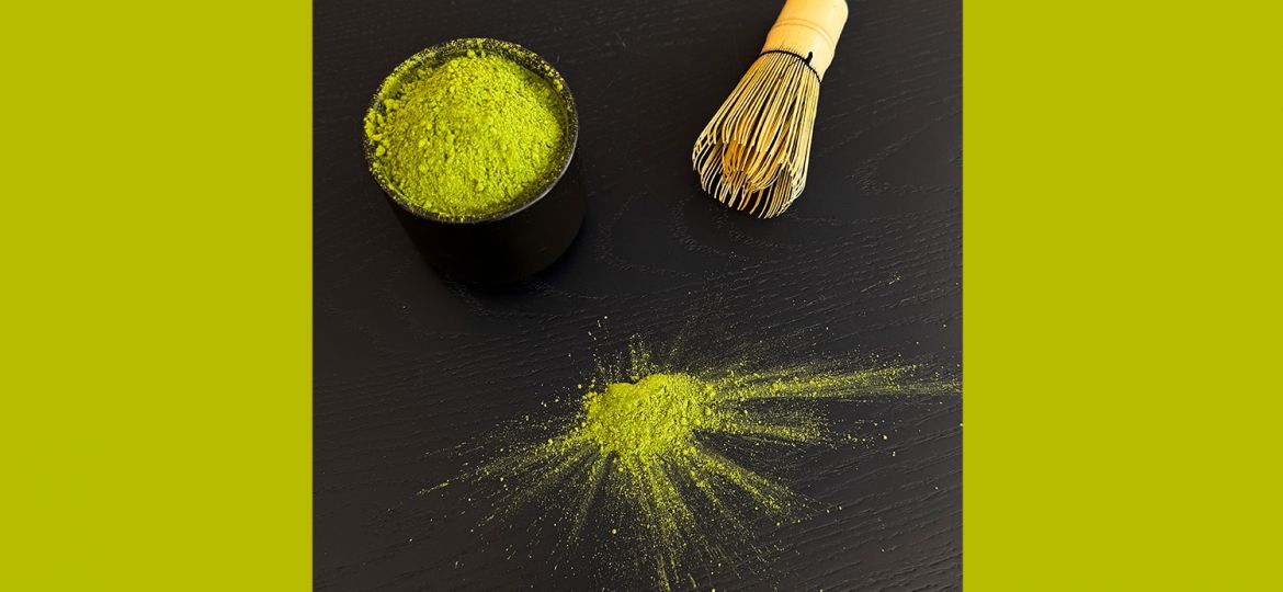 matcha tea on dark wooden table with green color pop