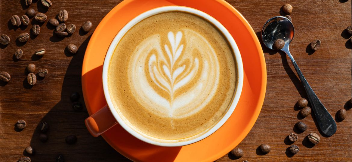 cup of premium coffee and beans from PureFyx Cleveland