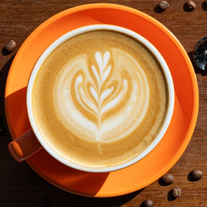 cup of premium coffee and beans from PureFyx Cleveland
