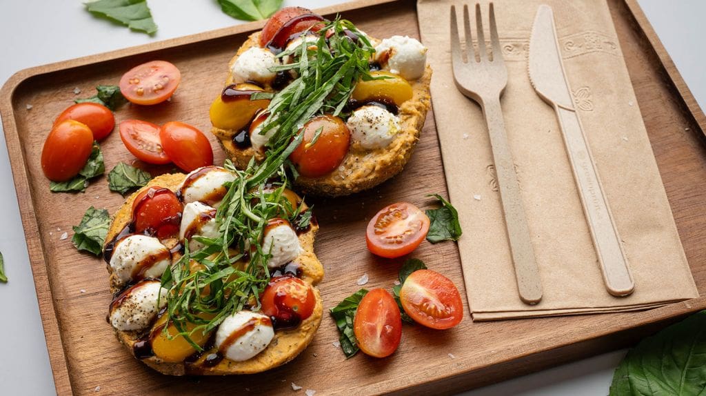 caprese 2.0 - Zata’ar Bagel, Roasted Tomato Basil Hummus, Fresh Mozzarella, Heirloom Tomato, Black Pepper, Micro Basil, Balsamic Glaze
