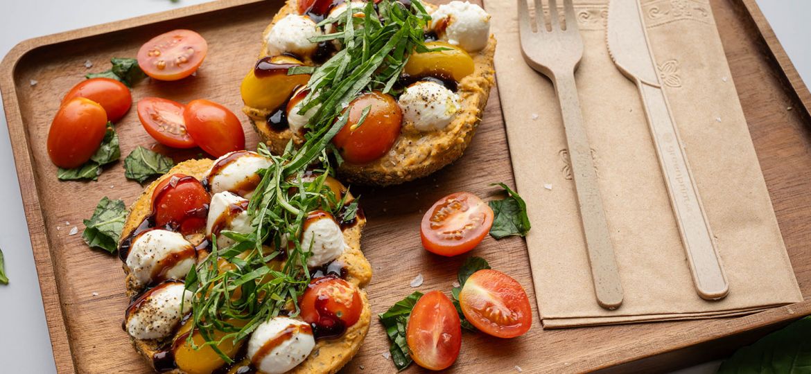 caprese 2.0 - Zata’ar Bagel, Roasted Tomato Basil Hummus, Fresh Mozzarella, Heirloom Tomato, Black Pepper, Micro Basil, Balsamic Glaze