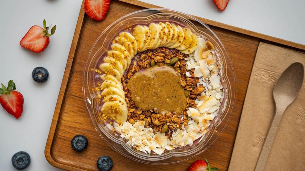 Gainz Smoothie Bowl with Acai, Banana, Strawberry, Camu Camu, Grass-Fed Protein Powder Base Topped with Banana, House Granola, Peanut